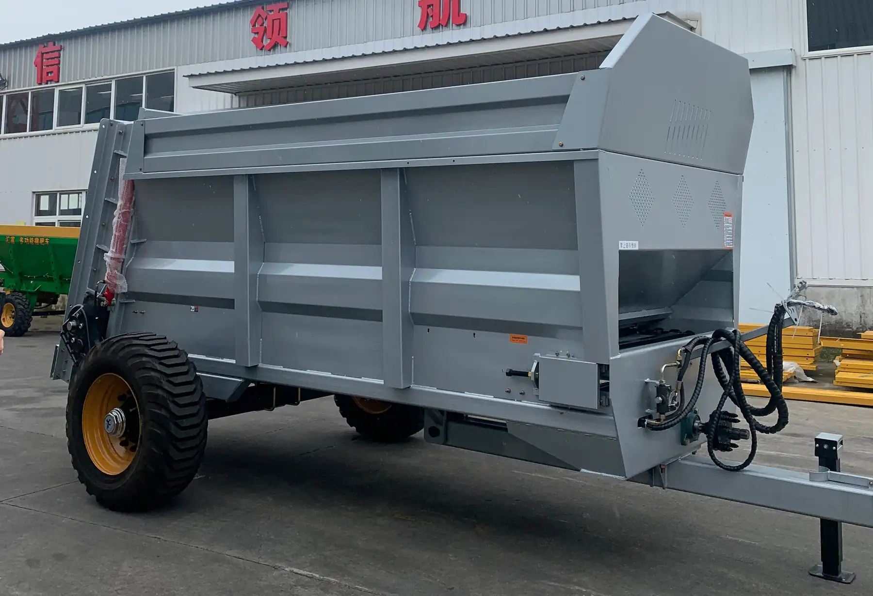 Custom tractor-towed stainless steel twin vertical beater manure spreader